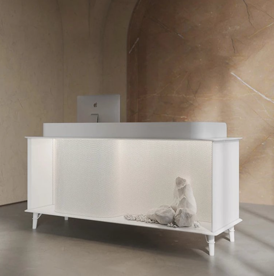 ミニマルデザインの受付カウンター | 穏やかな石の装飾