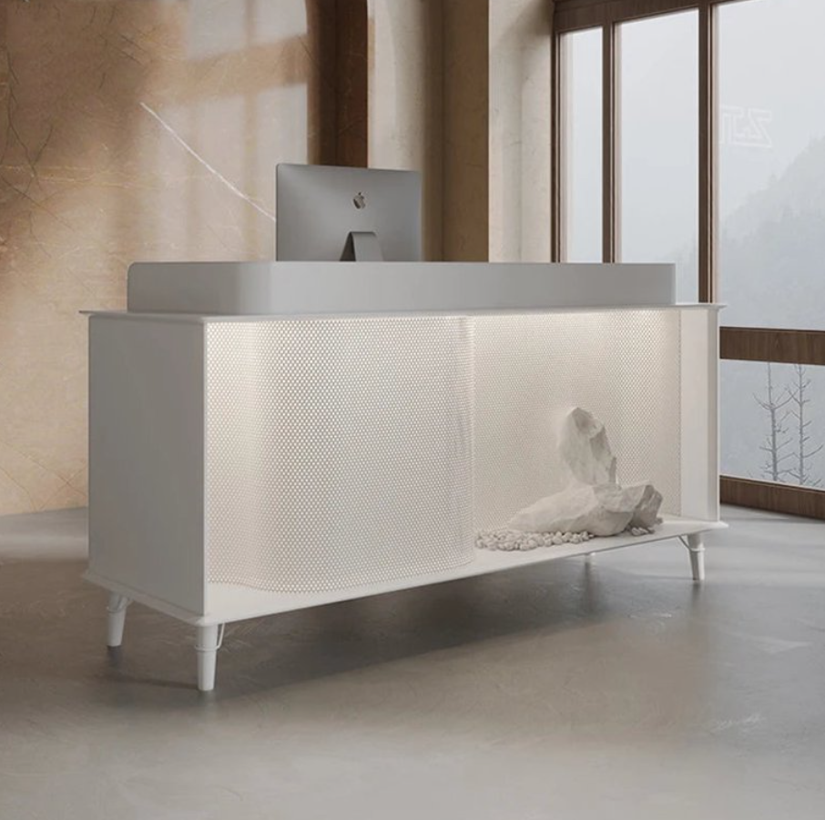 ミニマルデザインの受付カウンター | 穏やかな石の装飾