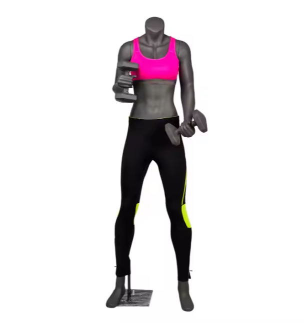 ピンクのトレーニングウェアを着用した女性フィットネスマネキン|ダンベルポーズ