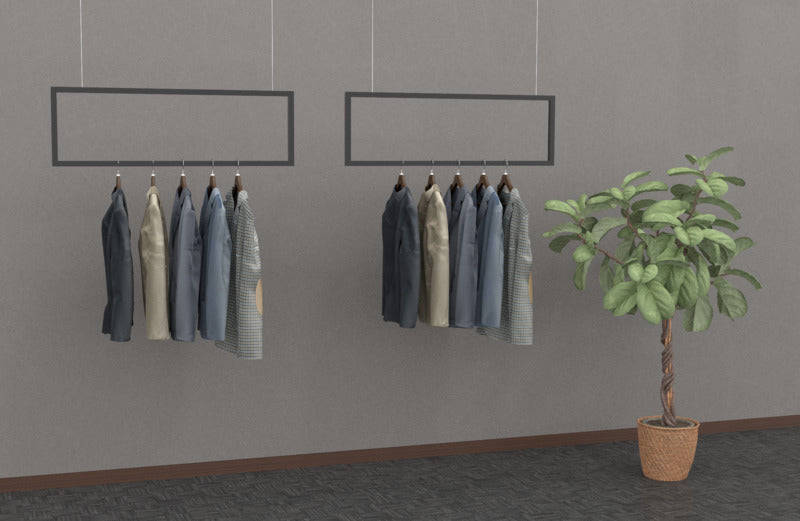 ブラックフレームの壁掛けハンガーバーに衣類と観葉植物を合わせたインテリアディスプレイ