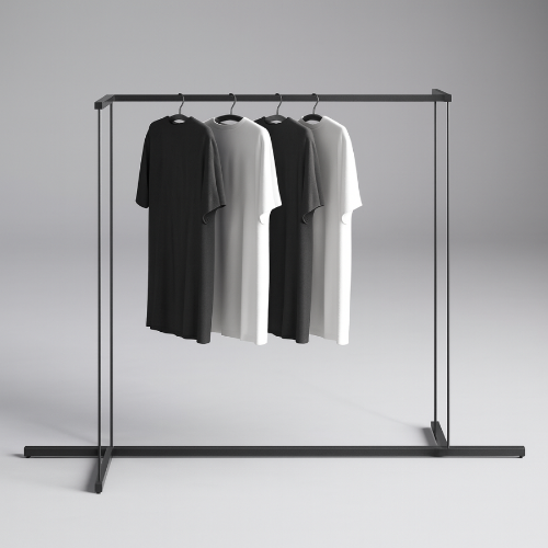 シルバーフレームのハンガーラックに黒と白のTシャツを掛けたモダンな商品ディスプレイ