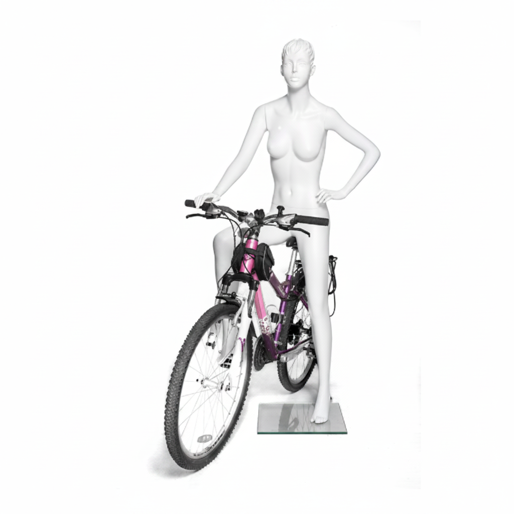 サイクリングポーズの女性スポーツマネキン展示例｜無着衣・ピンクの自転車に乗ったディスプレイ