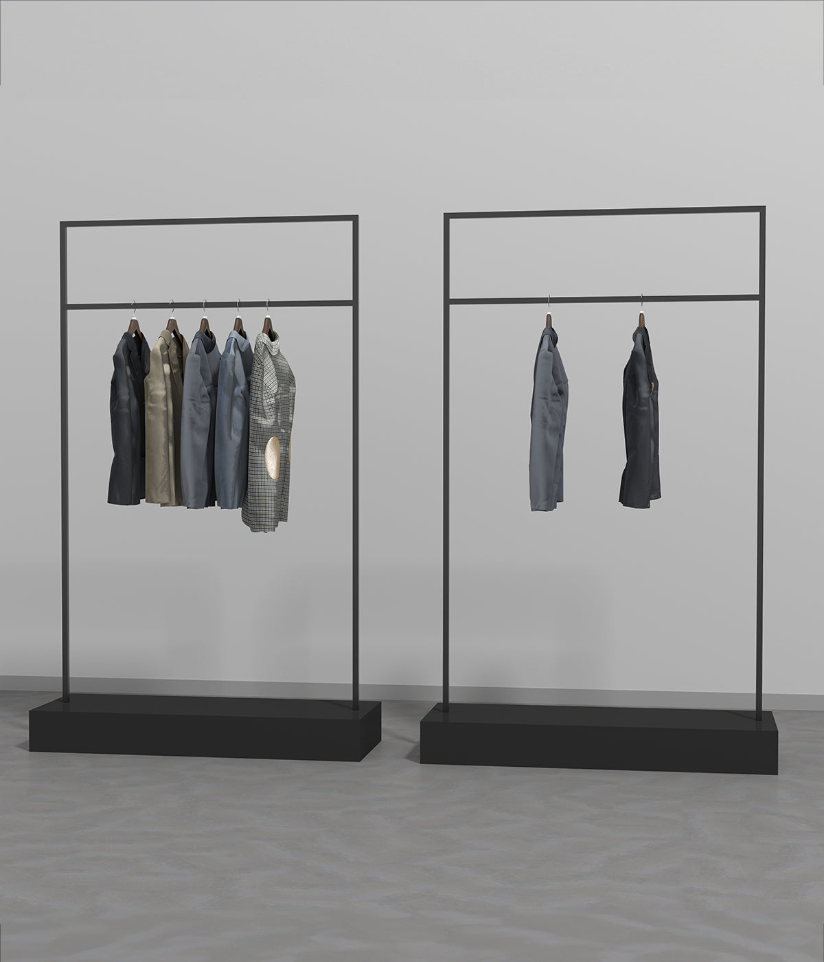 ブラックフレームのハンガーラック2台に衣類を展示したシンプルなショップディスプレイ